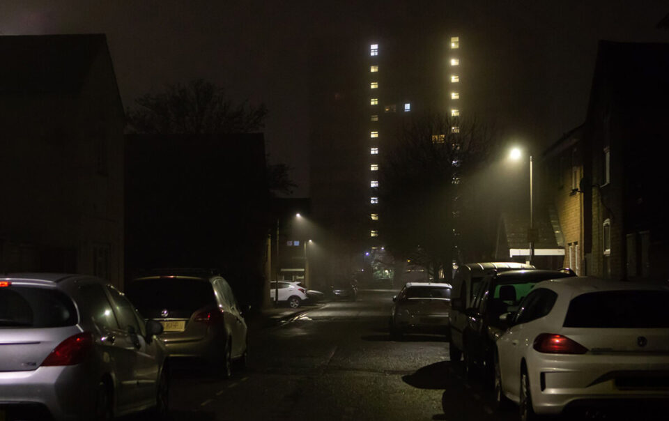 dark street with vehicles.