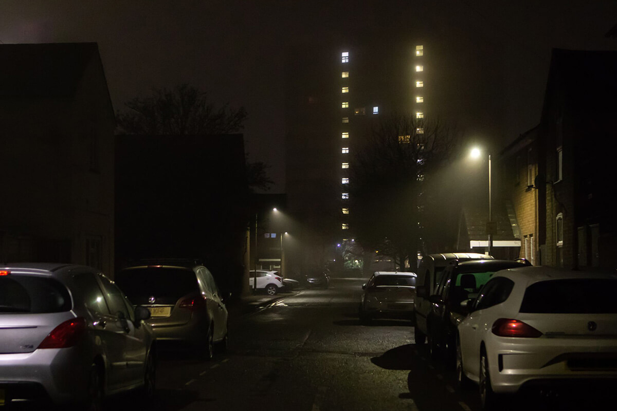 dark street with vehicles.