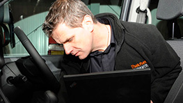 A member ot the Thatcham team working on a vehicle