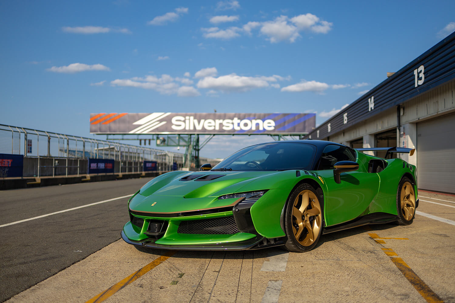 Ferrari in front of the Silverstone sign