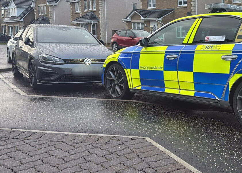 Police car in front of other car